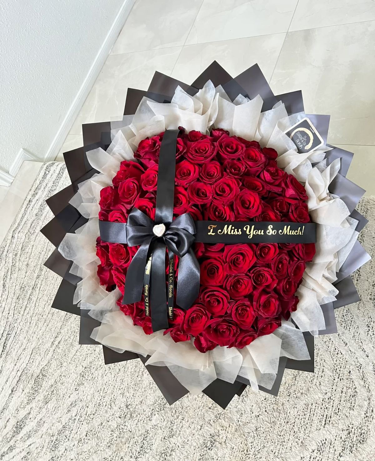 Hand-wrapped bouquet of one hundred red roses