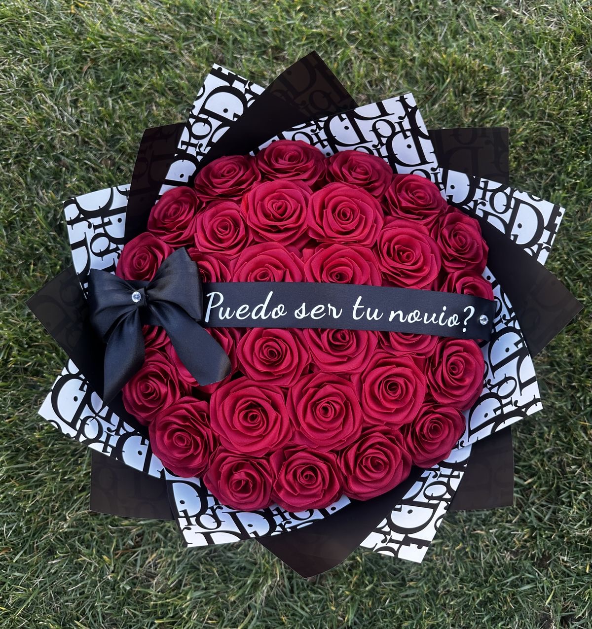 Hand-wrapped bouquet of fifty red roses